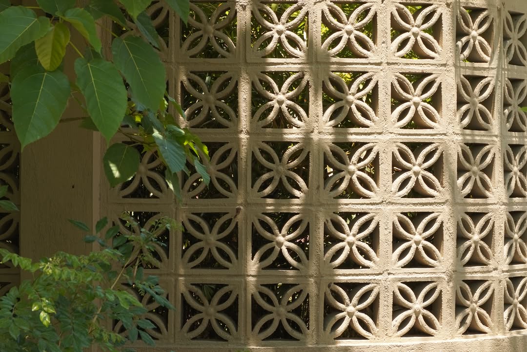 Detail of original breeze block wall pattern with foliage