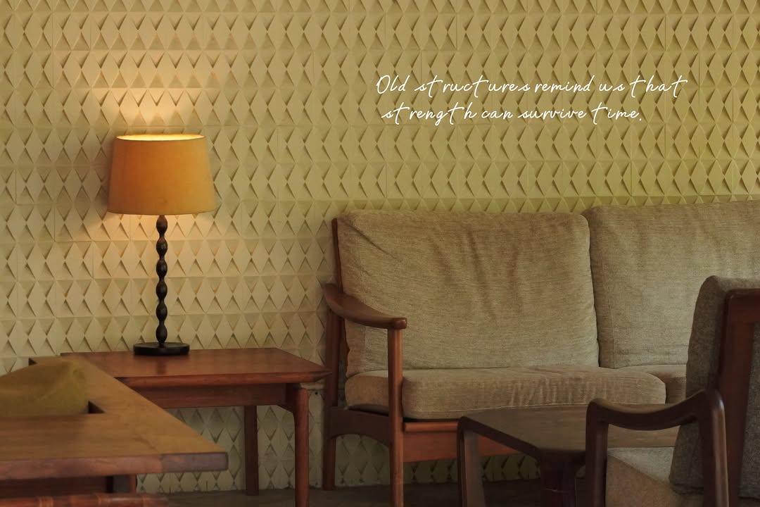Midcentury lounge area with original sofa and diamond wall relief