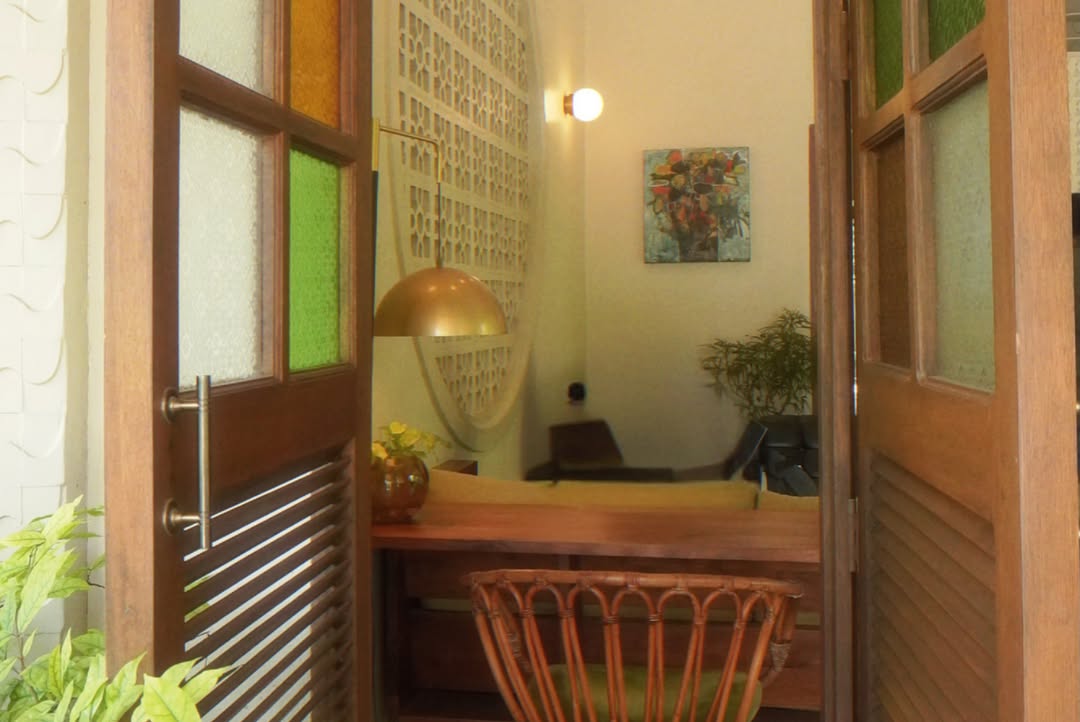 Lewis House reception nook with louvre doors and original interior details