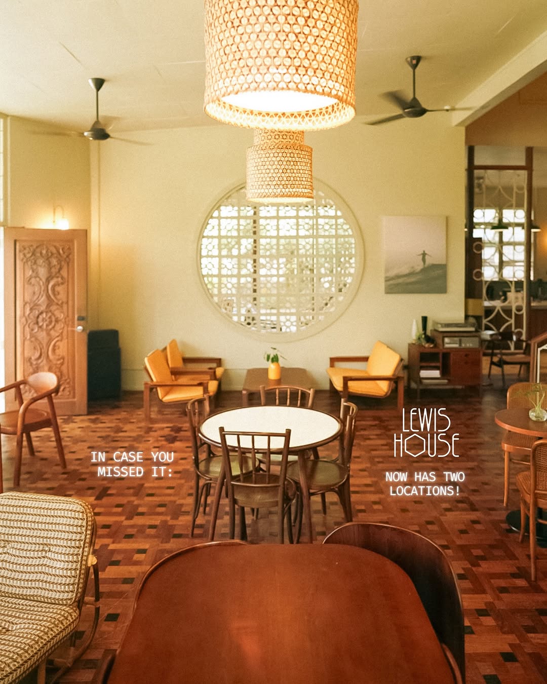 Lewis House main sala interior showing parquet floors and rattan lamps